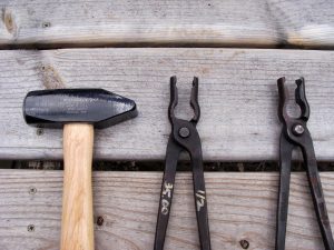 These are Tom Tongs next to a cross peen hammer - Brown County Forge